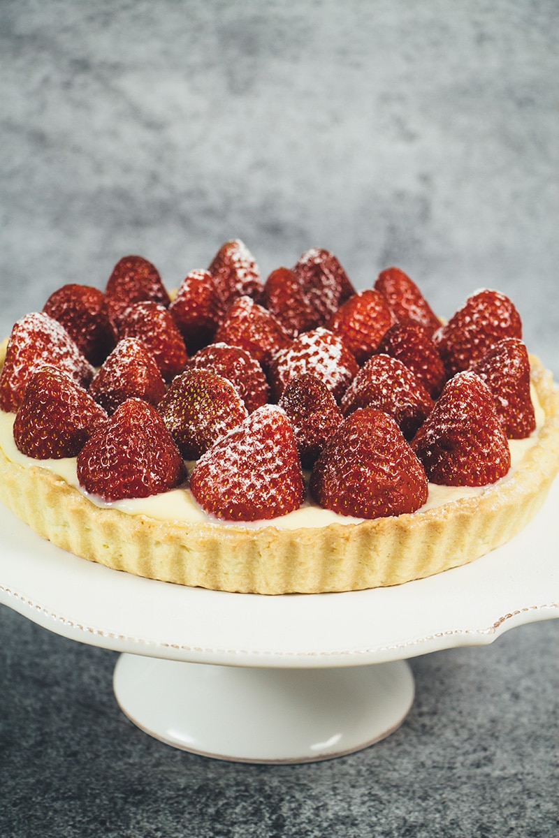 This French Strawberry Tart is literally the best thing you can make with fresh full-of-flavor strawberries. A buttery tart shell + custard + strawberries! | cookingtheglobe.com