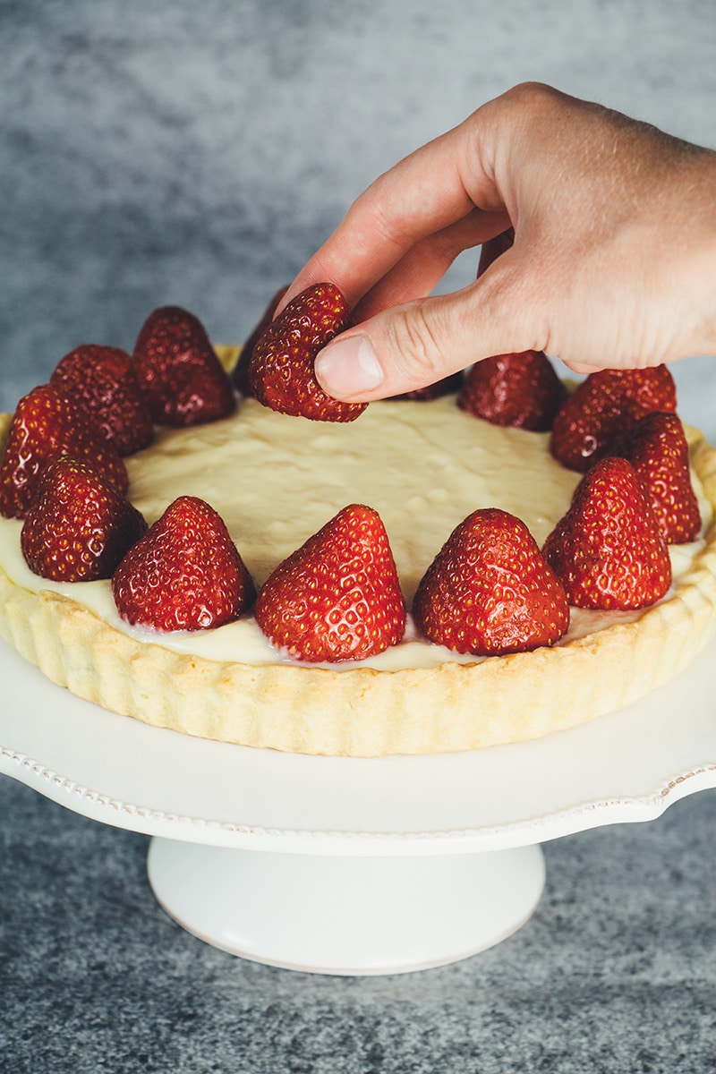 This French Strawberry Tart is literally the best thing you can make with fresh full-of-flavor strawberries. A buttery tart shell + custard + strawberries! | cookingtheglobe.com