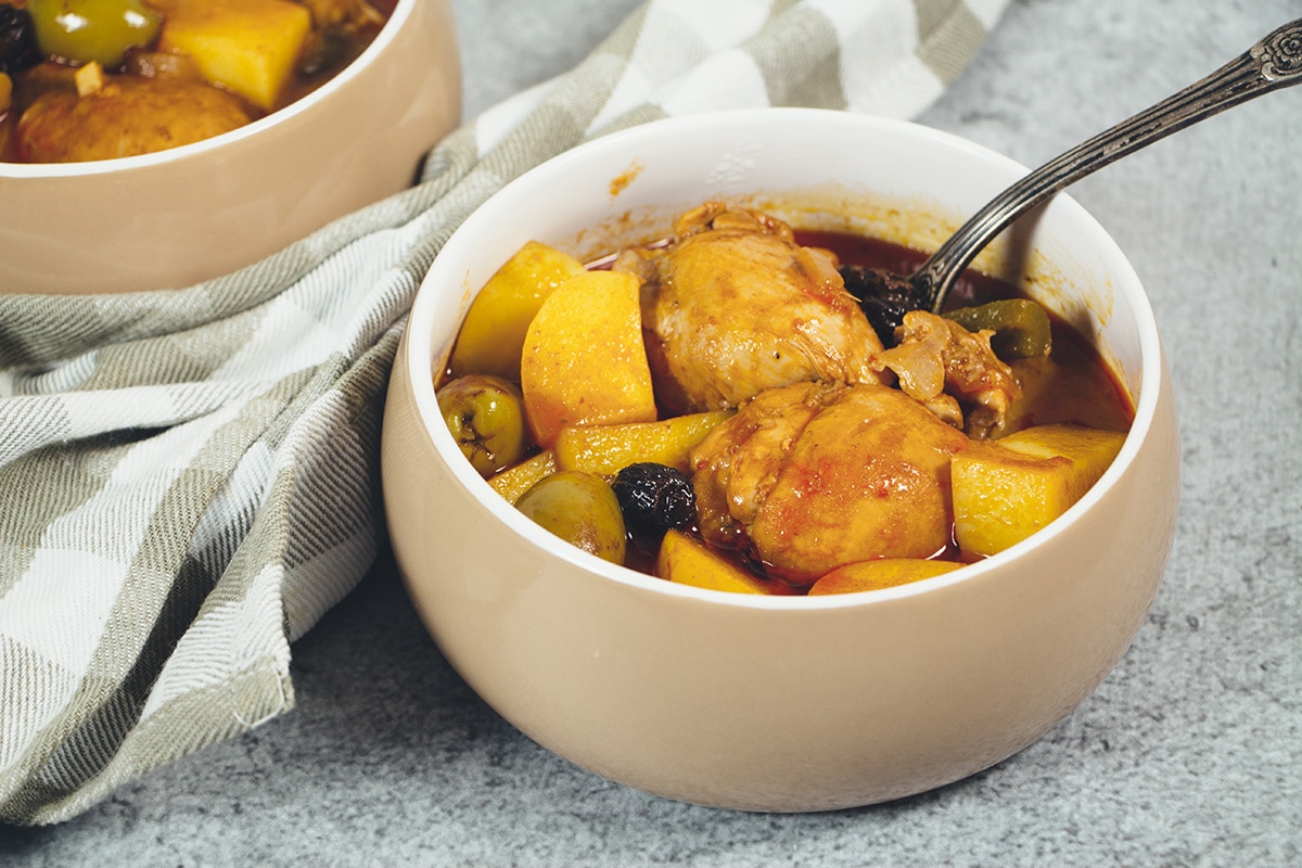 Fricase De Pollo is the famous Cuban chicken stew packed with tons of different flavors. A great stew the whole family will love! | cookingtheglobe.com