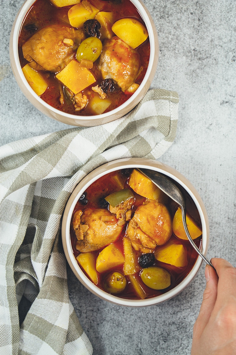 Fricase De Pollo is the famous Cuban chicken stew packed with tons of different flavors. A great stew the whole family will love! | cookingtheglobe.com