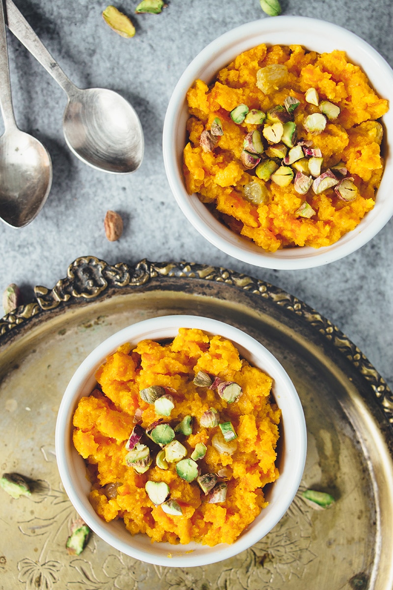 Gajar Ka Halwa is a well known Indian carrot dessert consisting of grated carrots, ghee, milk, sugar, and nuts. Infused with cardamom, it's truly amazing! | cookingtheglobe.com