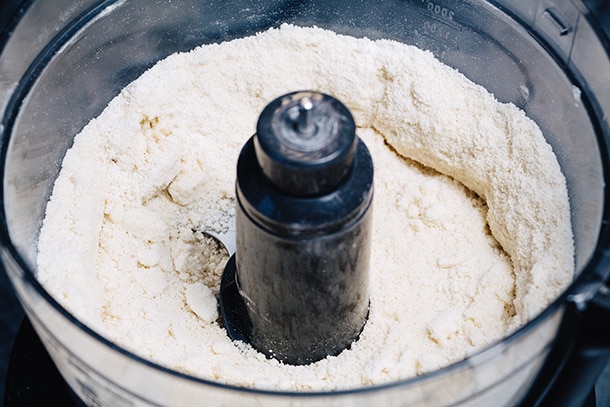 Mixing flour, butter, and salt in a food processor
