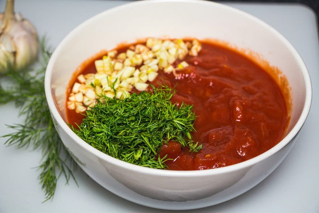 The canned tomato, dill, and garlic mixture for the cabbage soup