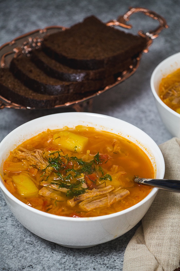 Russian cabbage soup served with black bread