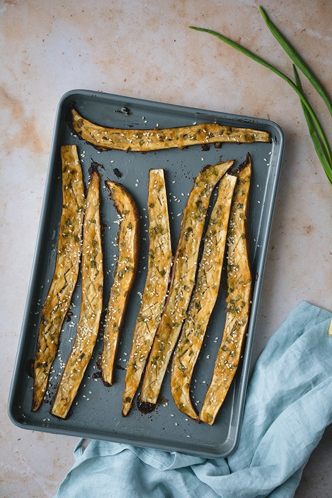 Miso roasted Japanese eggplant topped with white sesame seeds overhead shot