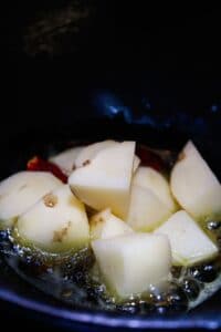 Potatoes in hot oil with red chile