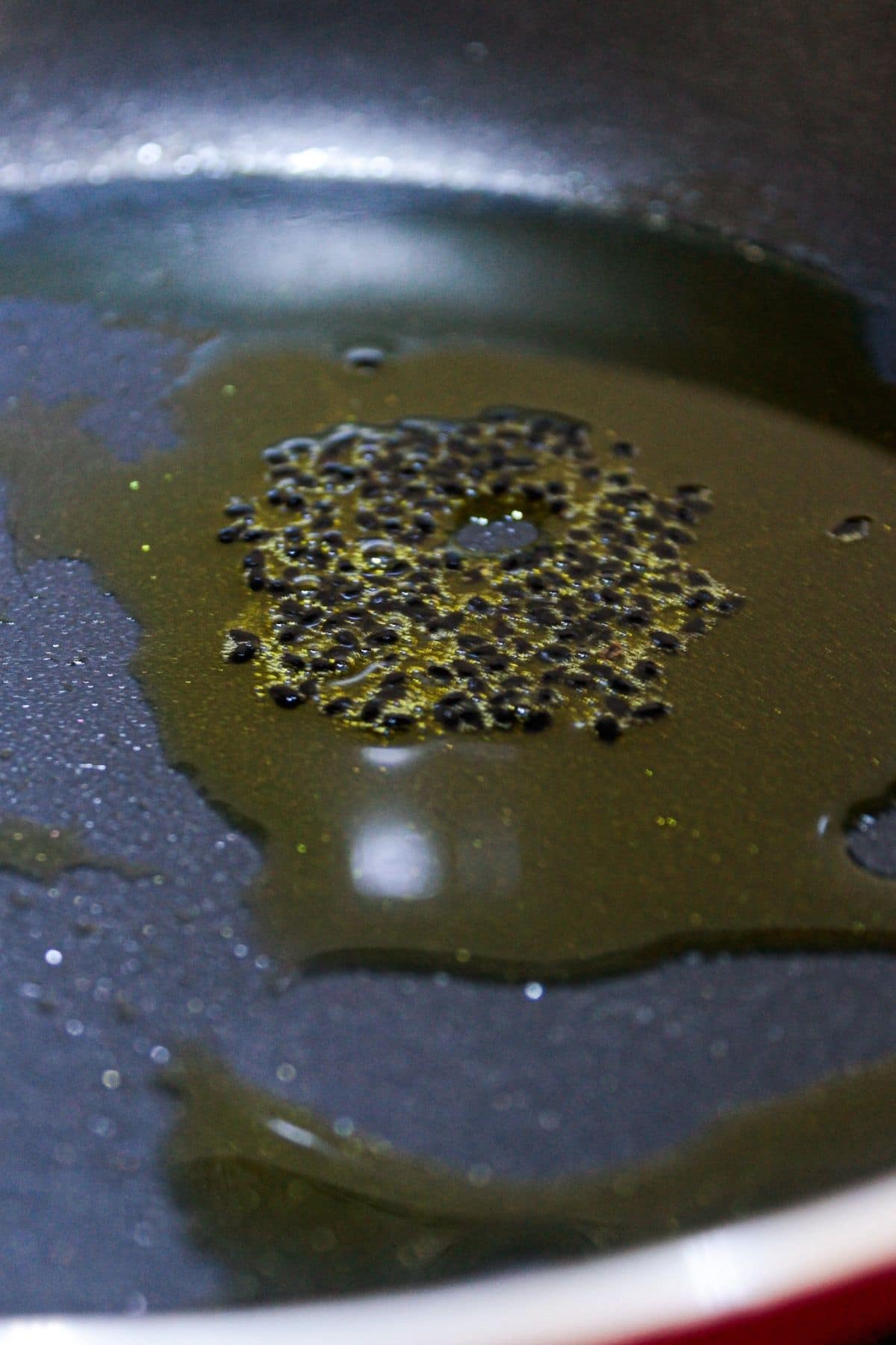 Oil and seeds in skillet