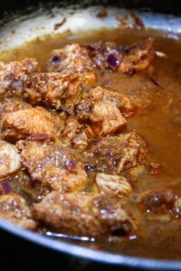 Chicken in vindaloo sauce in large skillet