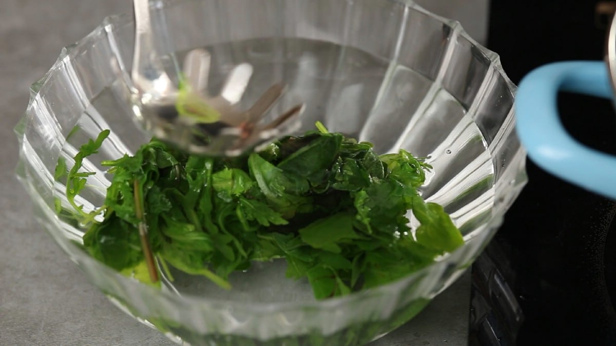 Greens in large bowl of water