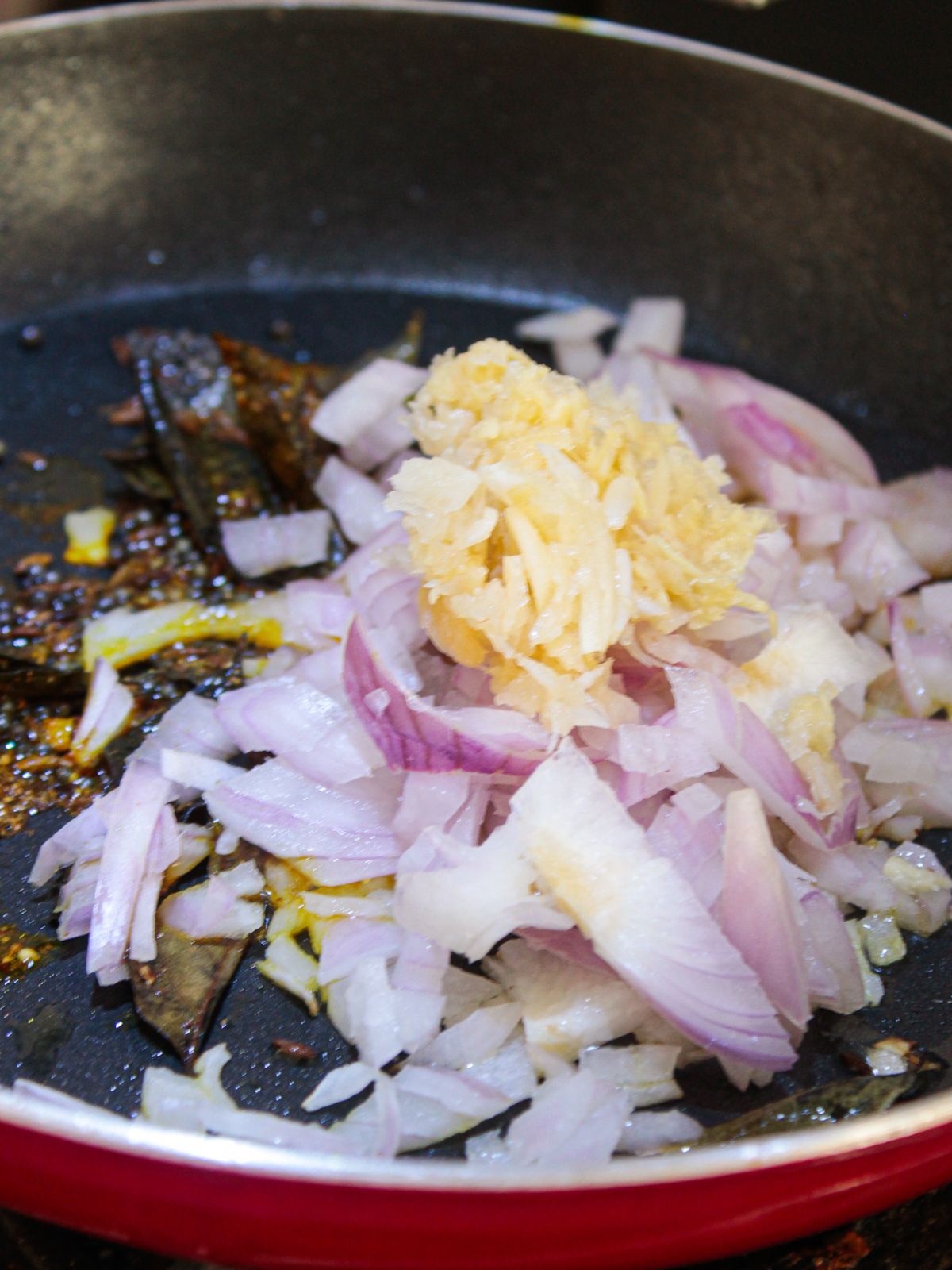 Onions in skillet with oil and ginger