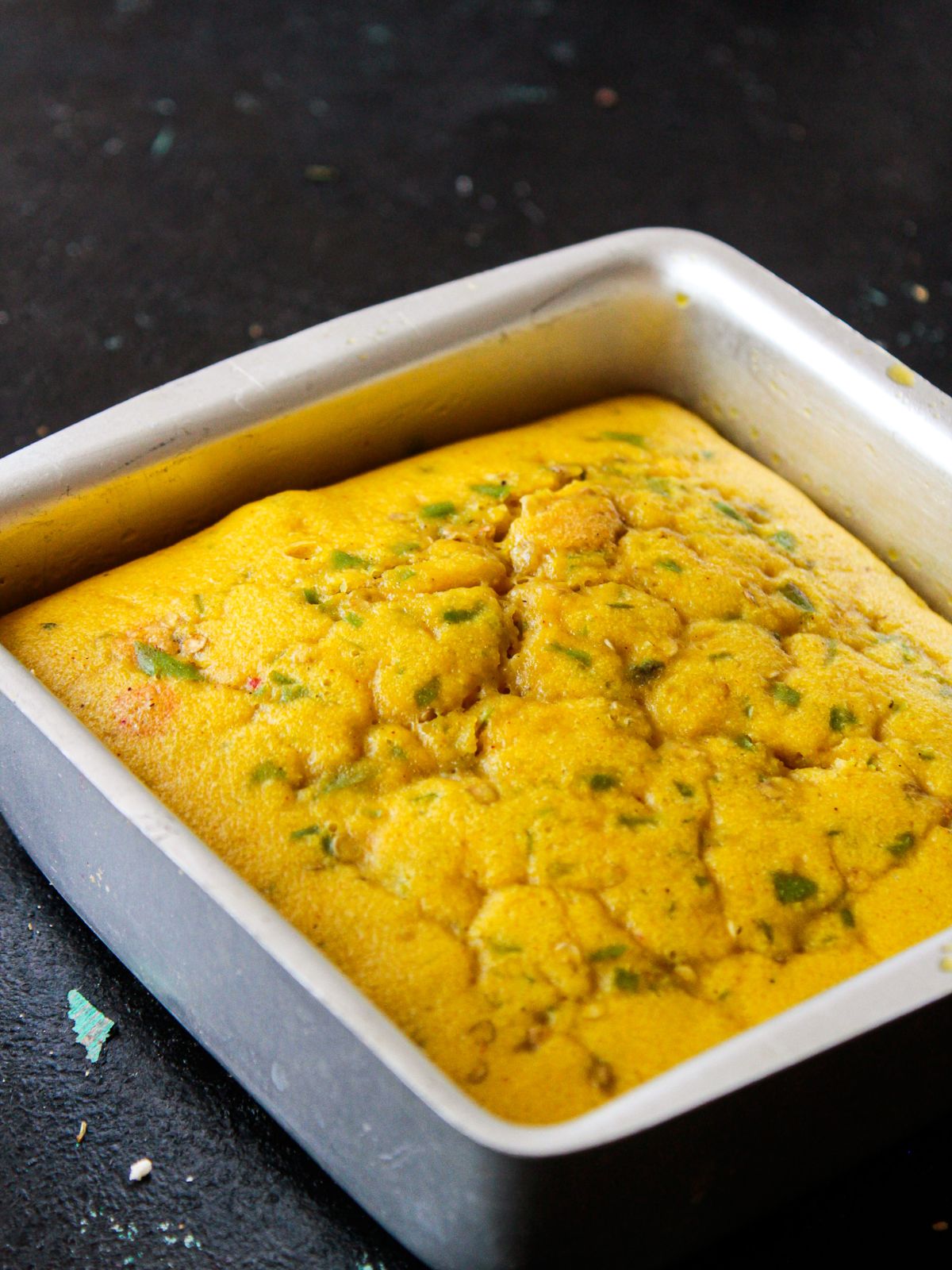 Cooked yellow cake in square white dish
