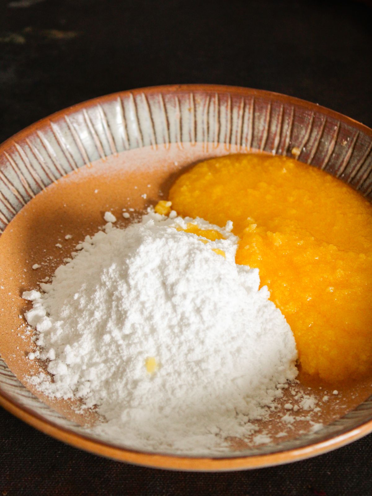 Ghee and powdered sugar in a bowl