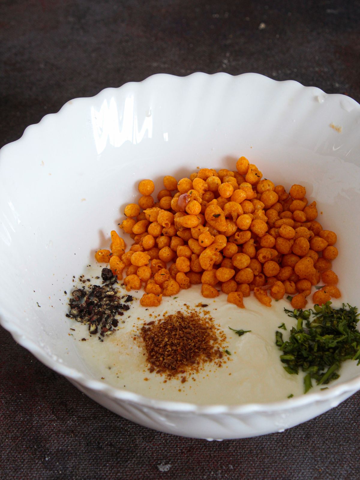 Mix all the ingredients of boondi raita in a bowl
