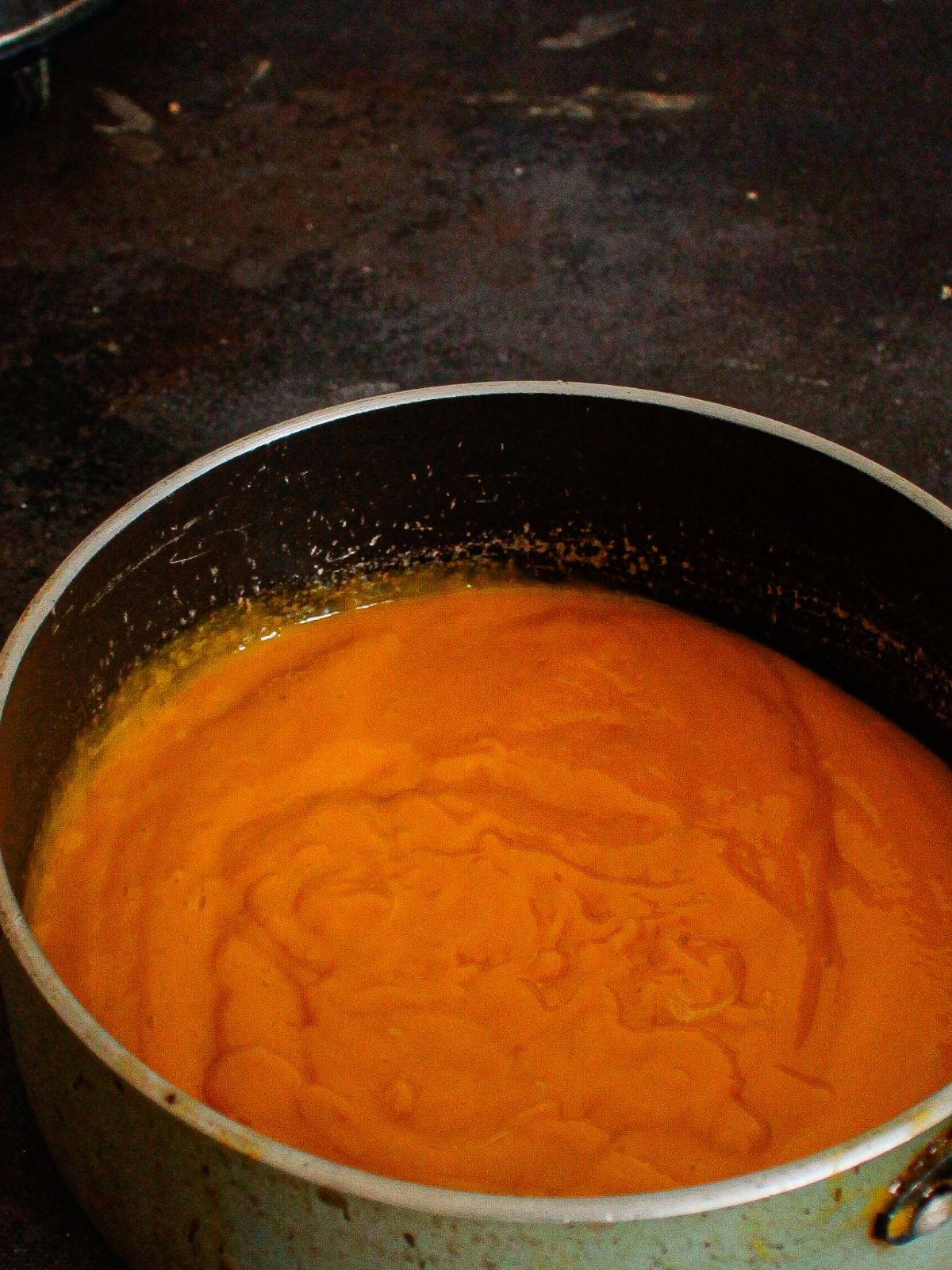 orange pudding in saucepan