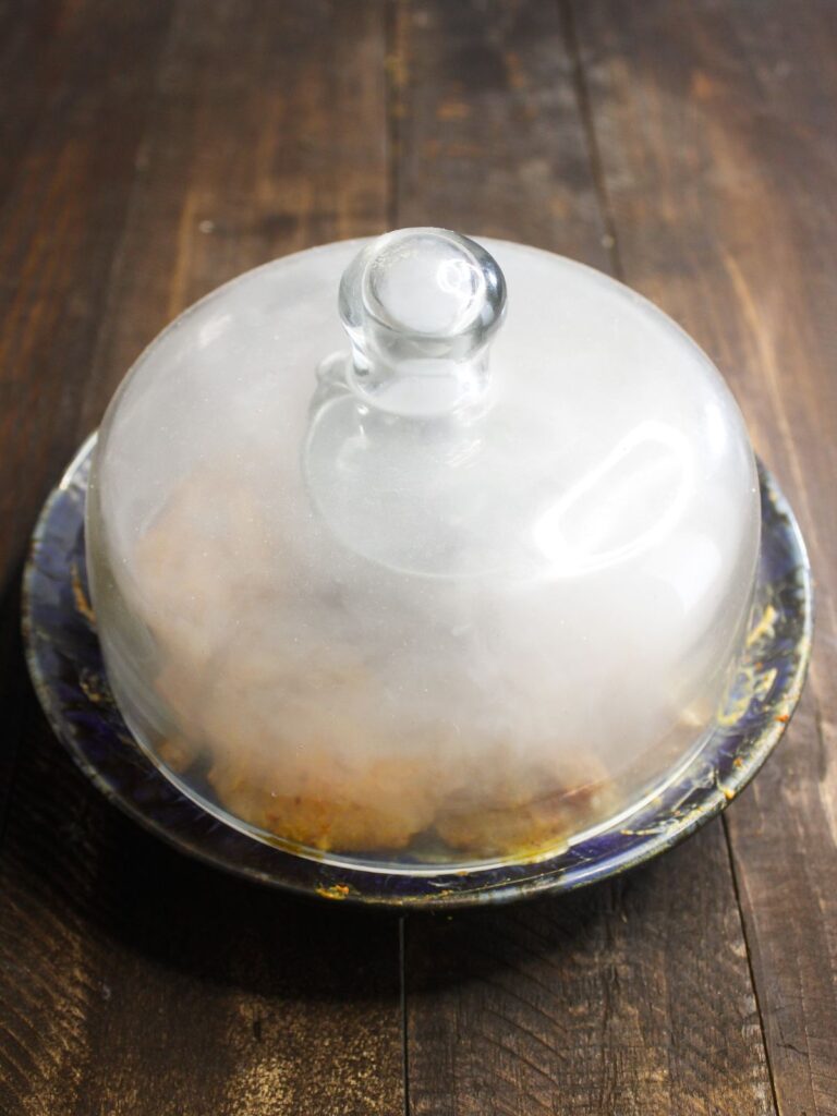 Once the smoke emerges, cover it with a lid and trap the smoke.