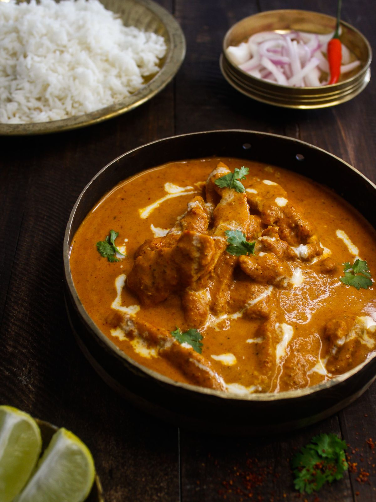 Butter chicken served with rice and rotis