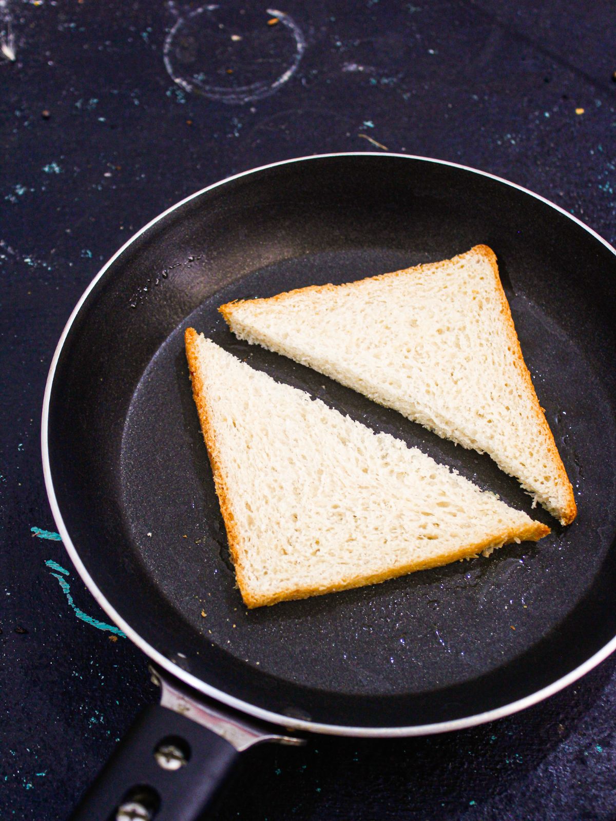 Cut the bread slices into triangle