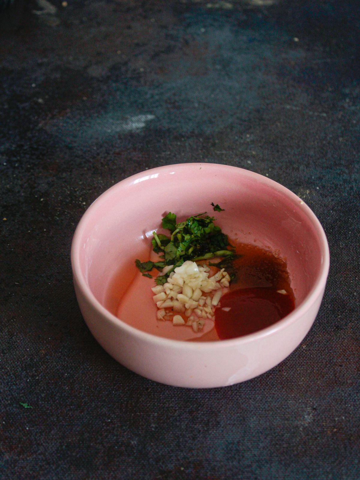 pink bowl of spices and sauce
