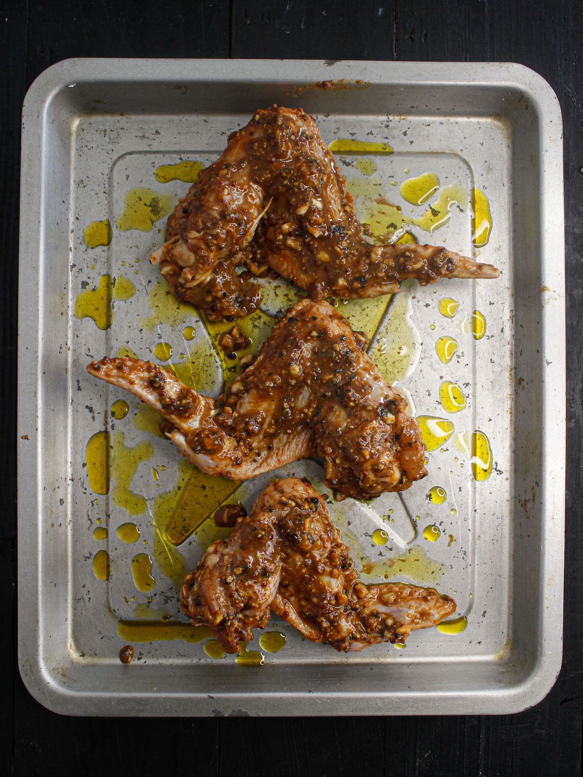 Place the marinated chicken on a baking tray nice brushed with some oil and bake it