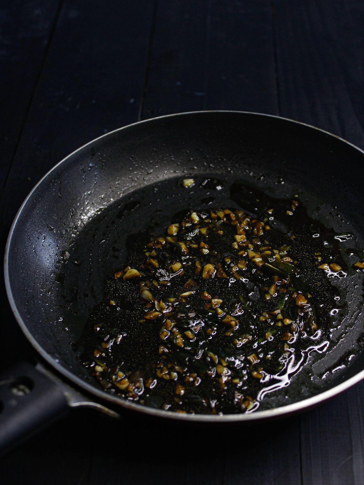 Add fish sauce, soya sauce and brown sugar in a pan and mix it.
