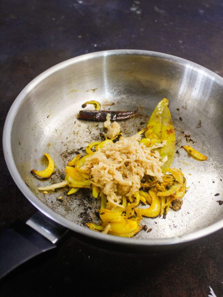 fermented bamboo shoot are then added to the pan