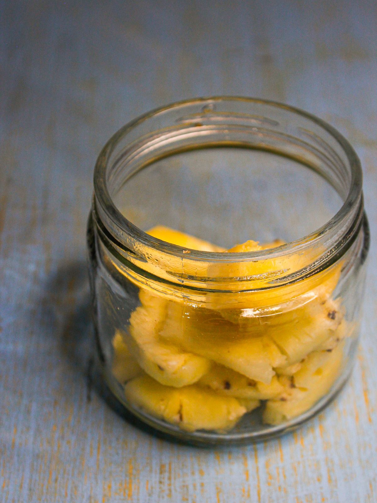 add pineapple pieces into the jar