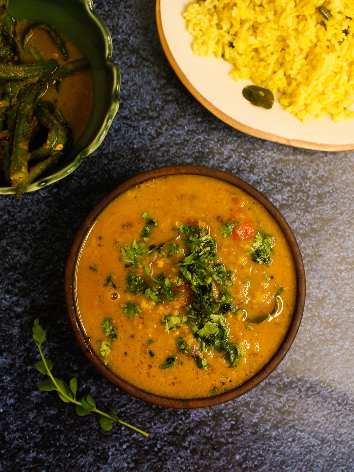 Sri Lankan Dal Curry garnished with mint leaves and served with yellow lemon rice