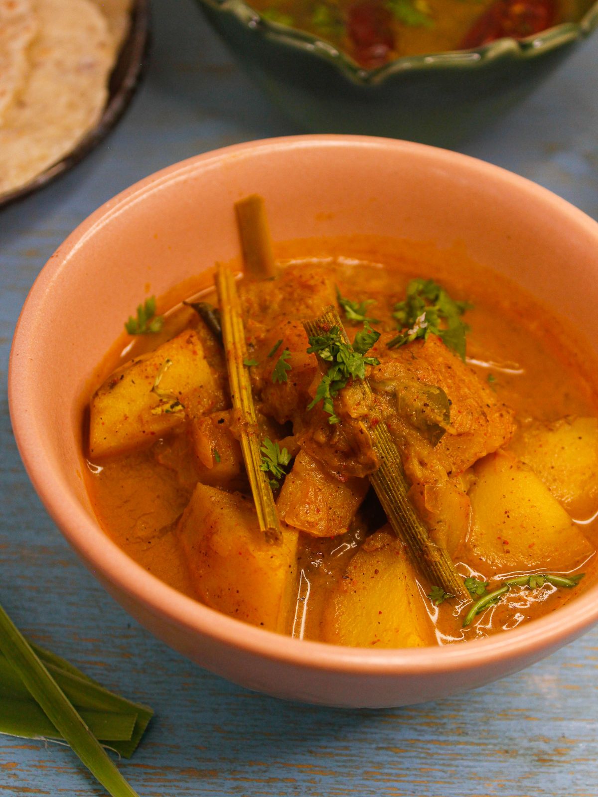 Easy Sri Lankan Potato Curry served in a bowl with rotis