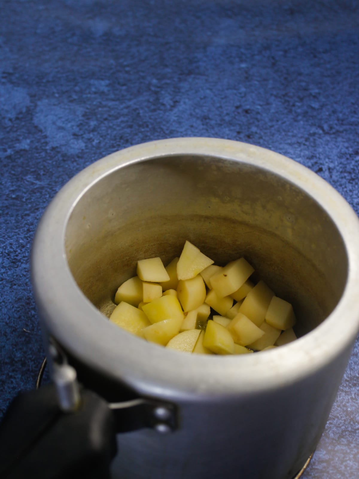 Now add cubed potatoes to the cooker