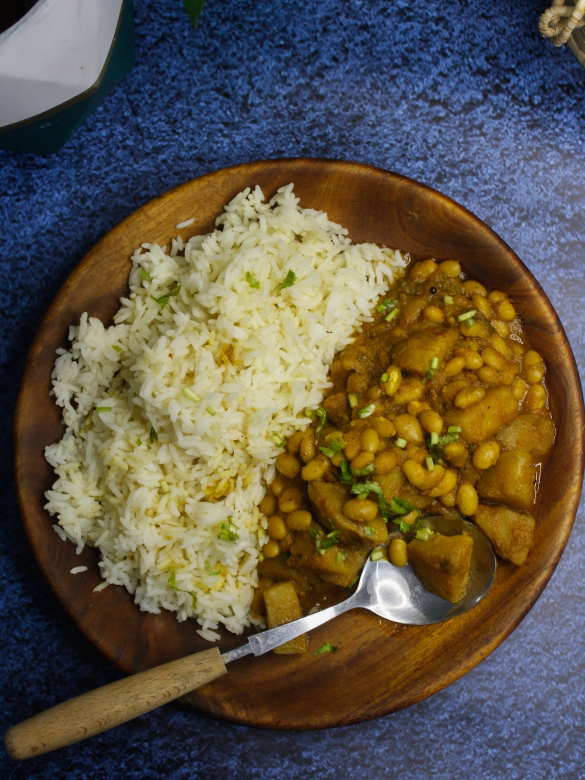 Top view of Easy Black-Eyed Pea Curry served on a wooden plate