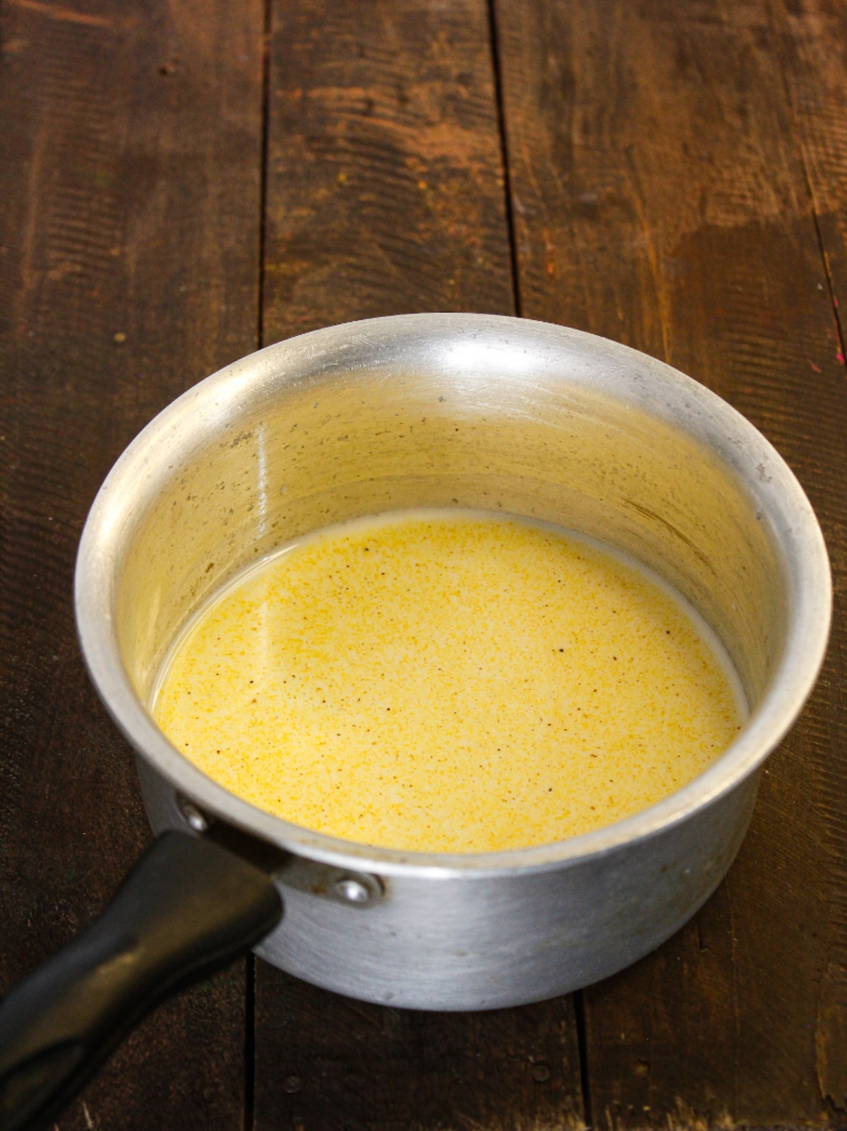 Add Turmeric powder to the milk