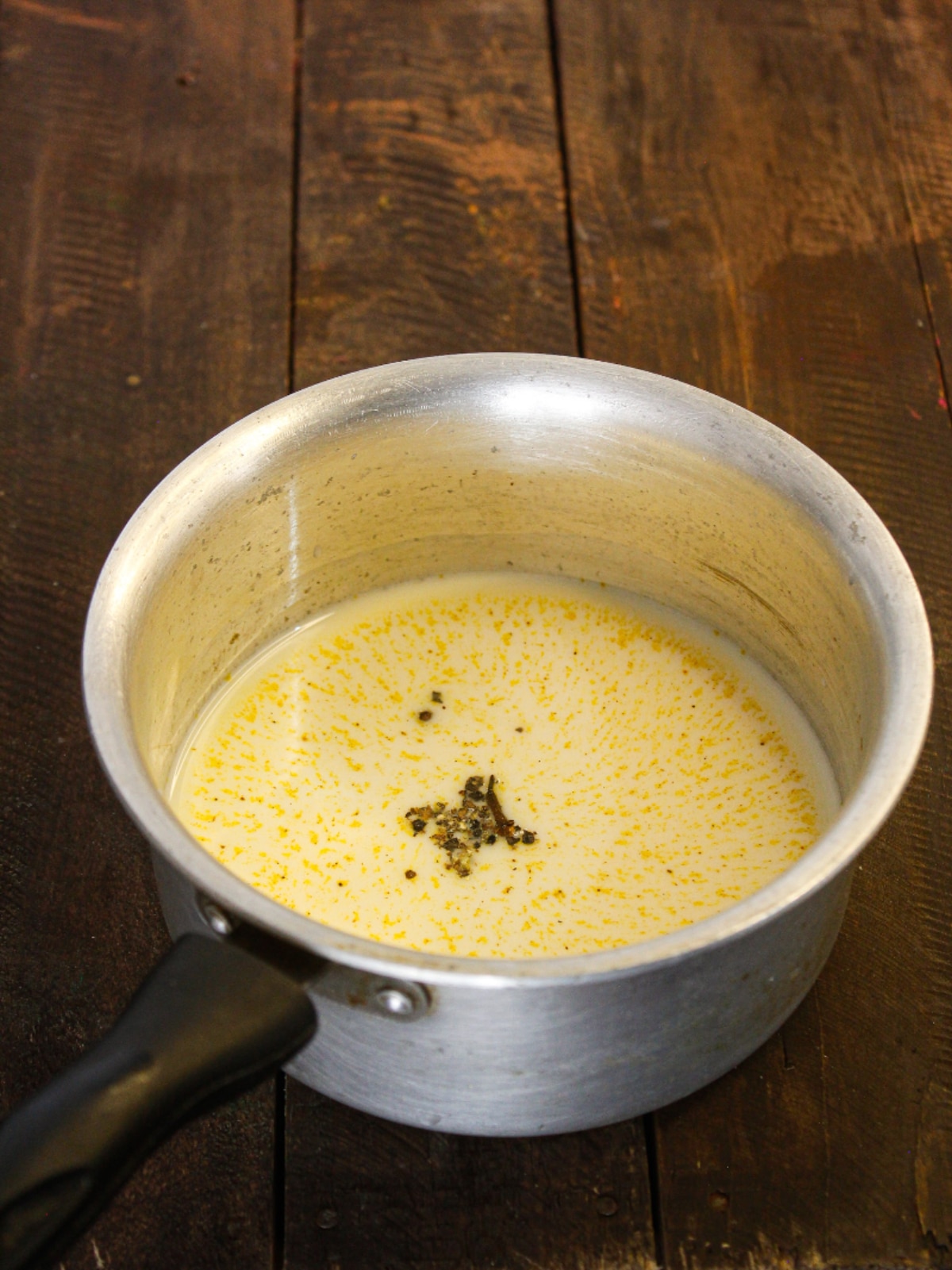 Add Black pepper powder to the milk
