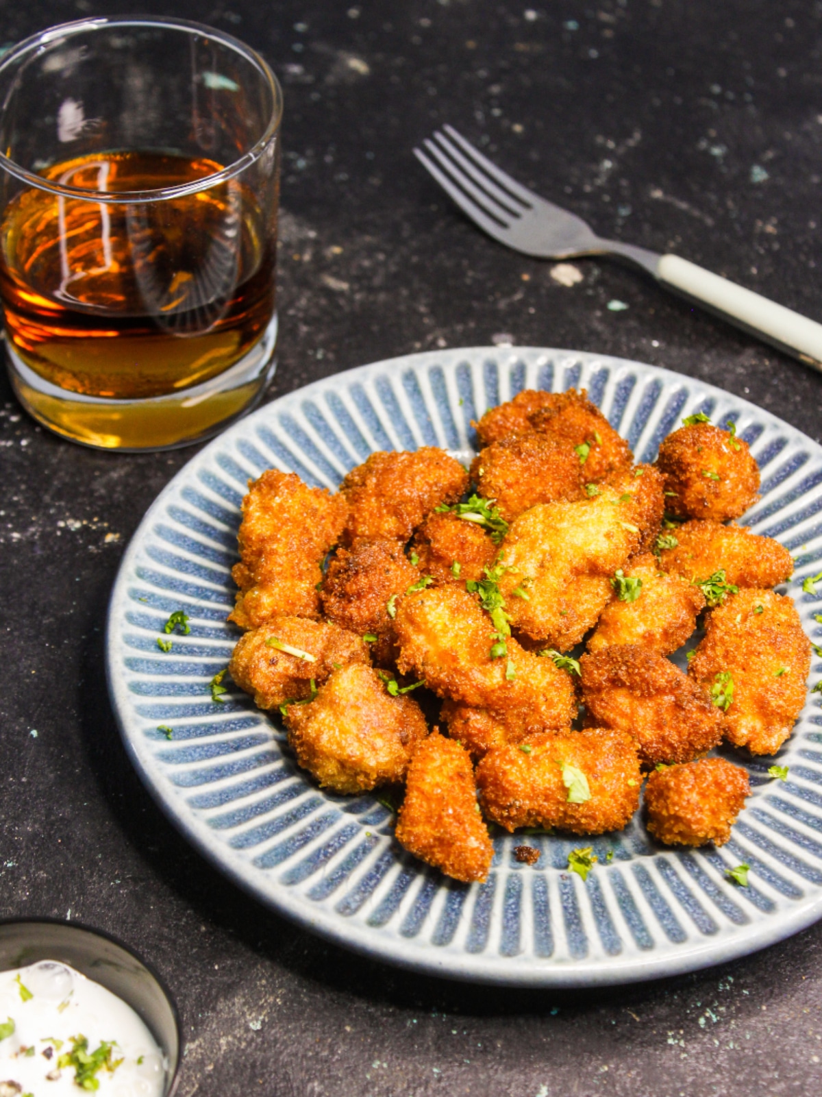 Spicy Chicken Popcorn served on a plate