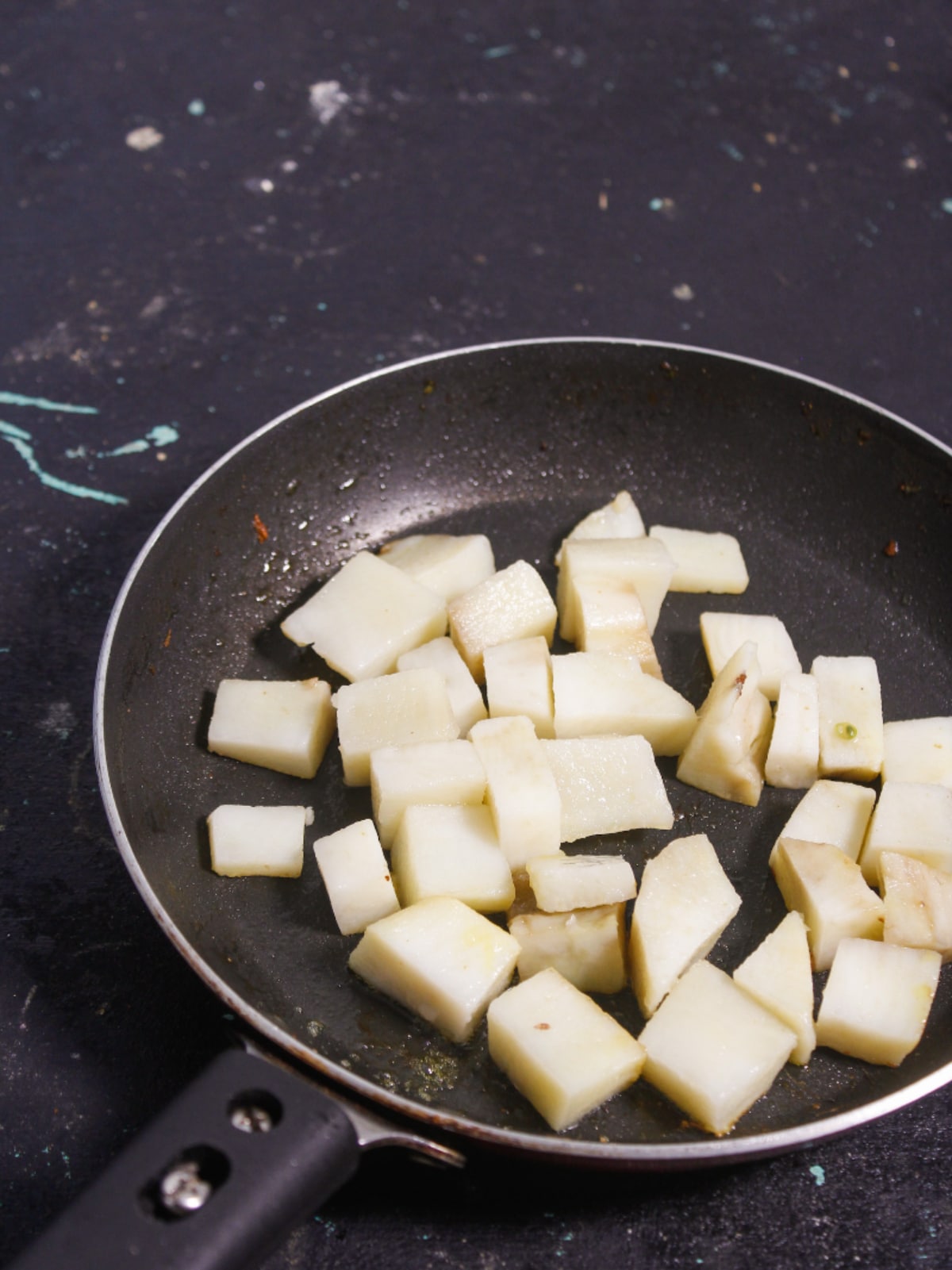 Add cubed potato in a pan and saute
